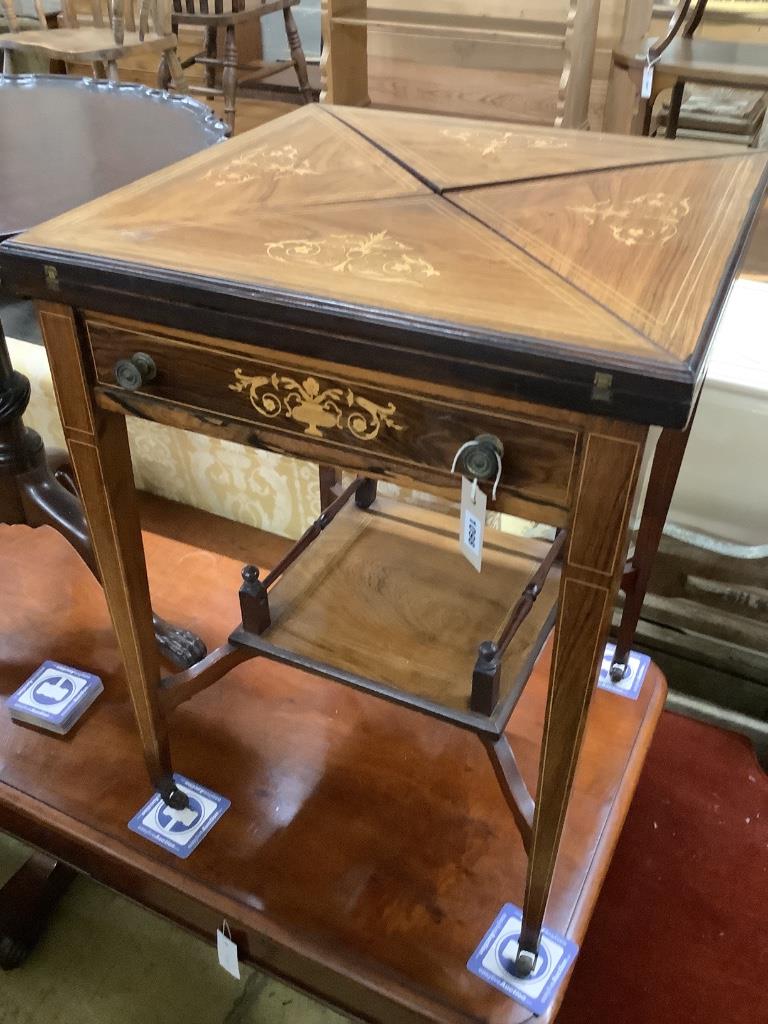 An Edwardian marquetry inlaid rosewood envelope card table, width 55cm, depth 55cm, height 74cm